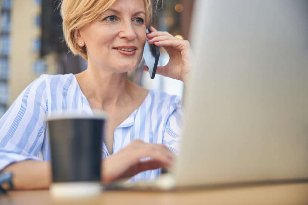 A woman that is happy with the details of the website design packages.