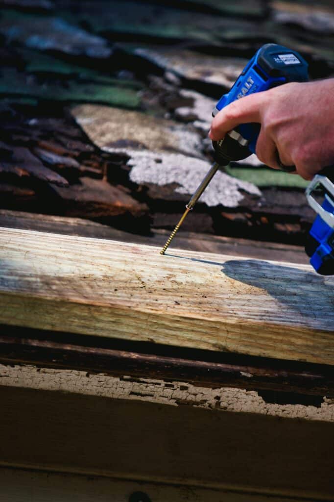 Man working on roof.