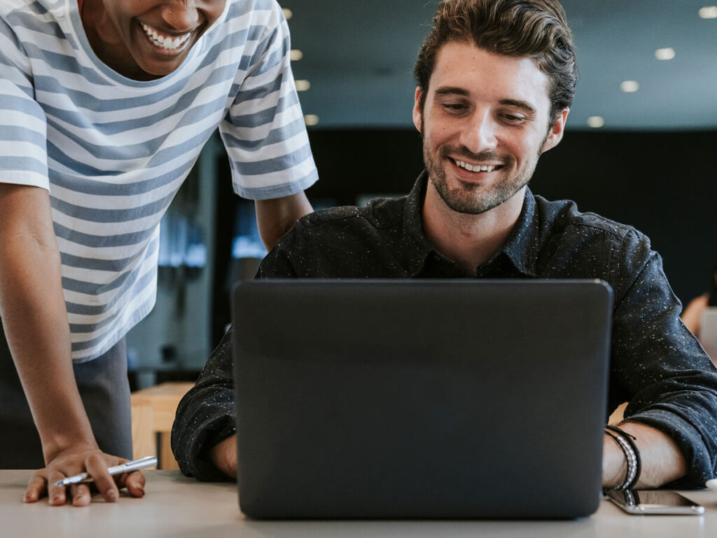 happy web design clients looking at finished WordPress web design